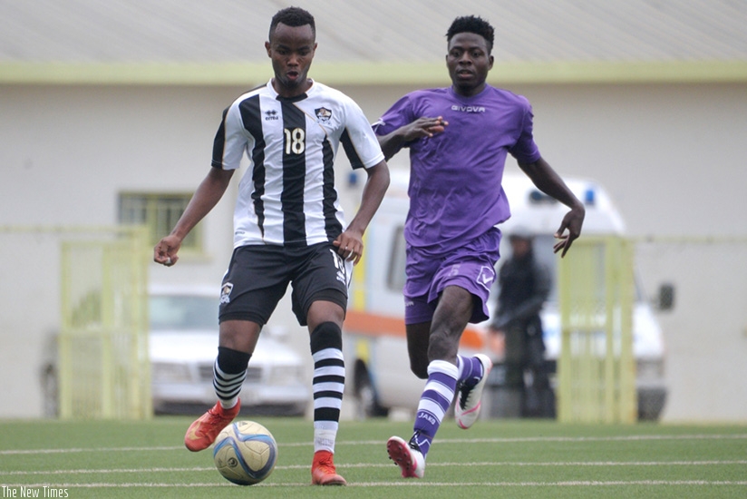 APR's Prince Buregeya protects the ball against Miroplast FC's Nigerian forward  Nana Akufo Addo on Wednesday. Courtesy