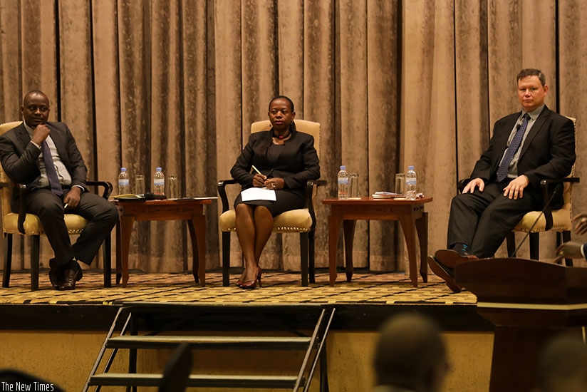 Jean Marie Nyirurugo, head of economics and financial crimes unit at the National Public Prosecution Authority (L), the Vice Governor of the central bank Monique Nsazabaganwa (C), ....