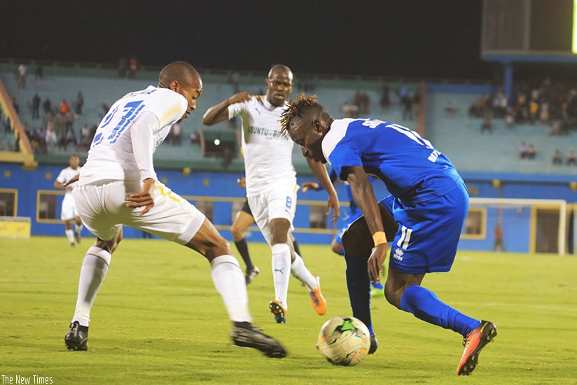 Rayon Sports forward Shaban u2018Shabalalau2019  Hussein (right) tries to go past Mamelodi Sundowns defender Morena Thapelo. Sam Ngendahimana.
