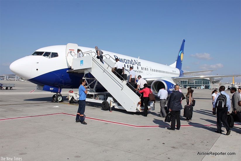Passengers board a RwandAir plane at Kigali International Airport. File.
