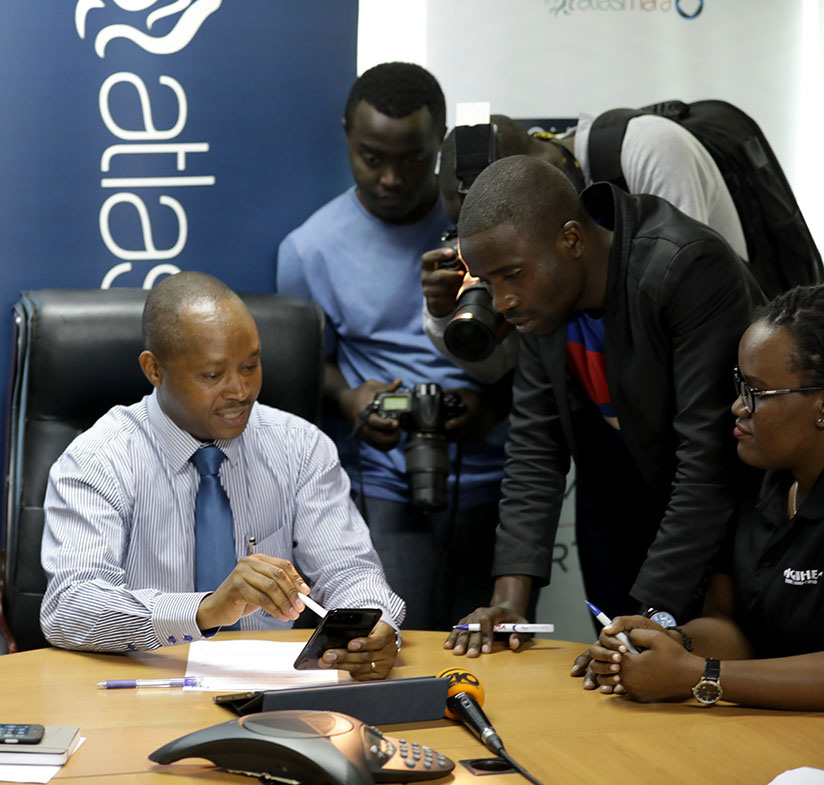 BPR Managing Director Maurice Toroitich, demonstrates how digital banking works recently. Timothy Kisambira.