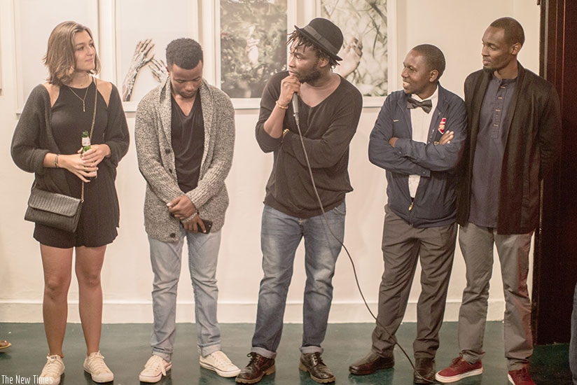 Jacques Nkinzingabo (centre) introduces some of the participating  rnphotographers at the opening ceremony in December last year. 