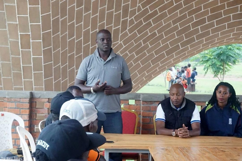 The Rwanda Cricket team on Sunday unveiled Martin Suji (standing) as the new head coach of national team. (Courtesy)