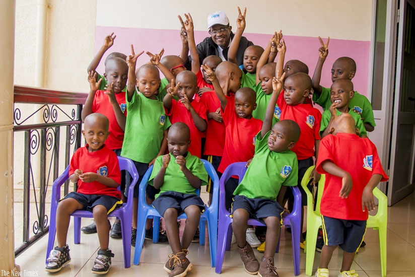 Nkusi poses for a group photo with visually impaired children under the care of Jordan Foundation. (Courtesy photos)