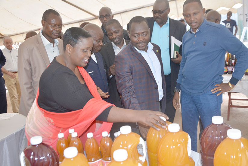 Murebwayire shows Rusizi officials some of the products at the expo. Courtesy.