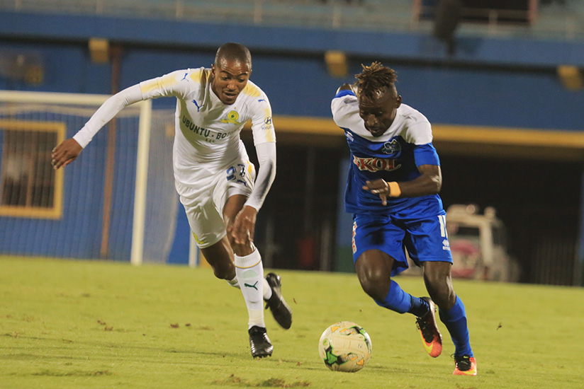 Rayon Sports forward Hussein Shan dribbles past Mamelodi defender Thapelo during their first leg match at Amahoro National Stadium. Sam Ngendahimana.