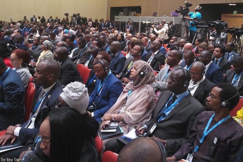Delegates follow a panel discussion at the business forum