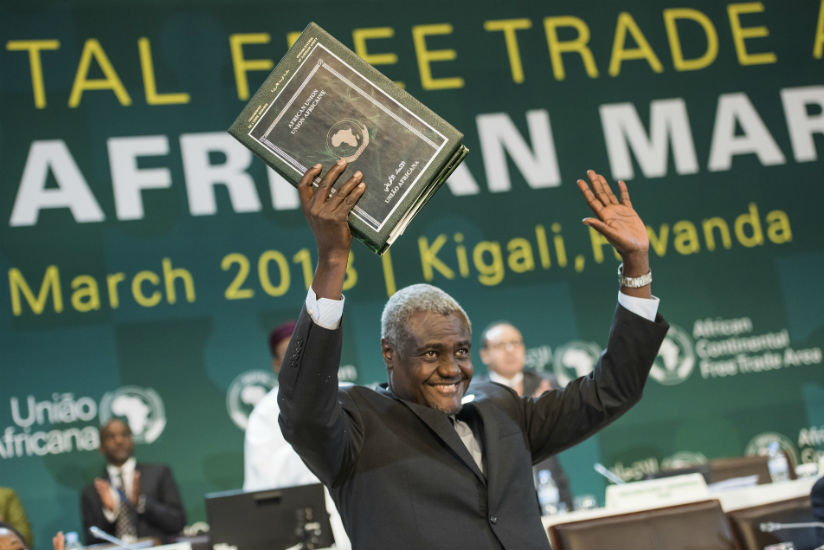 The Chairperson of the African Union Commission Moussa Faki Mahamat holds the instruments after they were signed by the heads of state and representatives from various African coun....