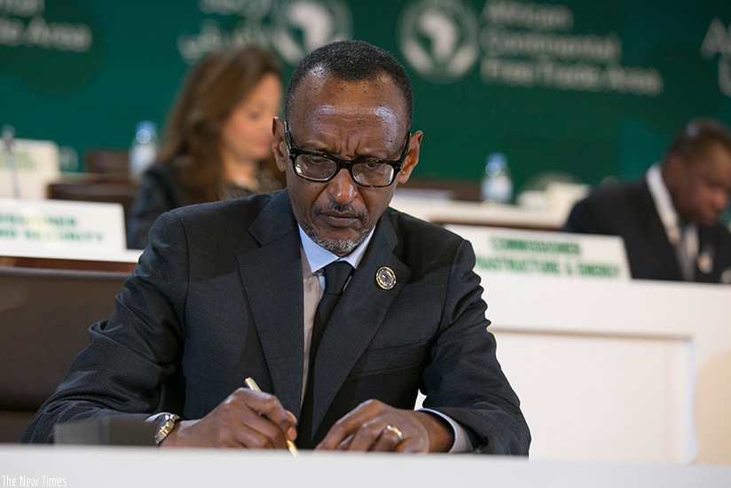 President  Paul Kagame signs the three historic instruments at the 10th Extraordinary Summit of the Heads of State and Government of the African Union at the Kigali Convention Cent....