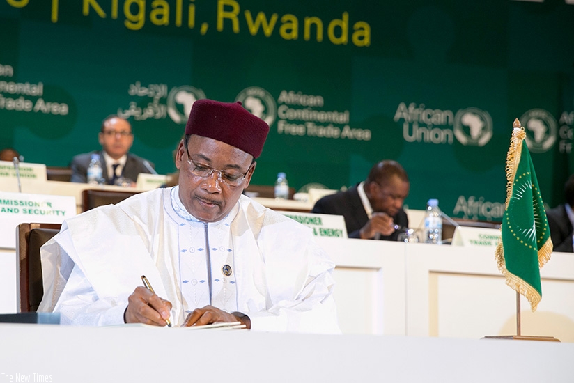 President Mahamadou Issoufou of Niger, who spearheaded the CFTA adoption process, was the first leader to sign the agreements in Kigali yesterday.  Courtesy.