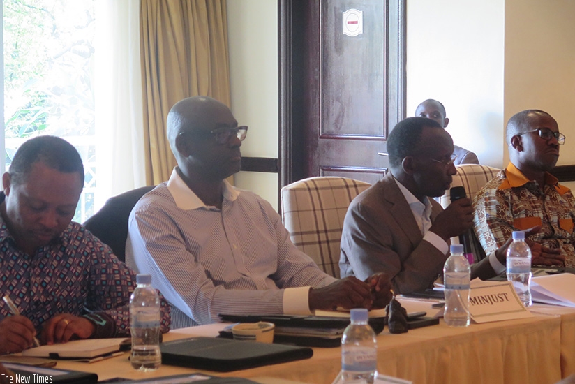 Chief Justice Sam Rugege speaks as Justice minister Johnston Busingye (second left), State minister for Constitutional and Legal Affairs Evode Uwizeyimana (extreme right) and RGB c....