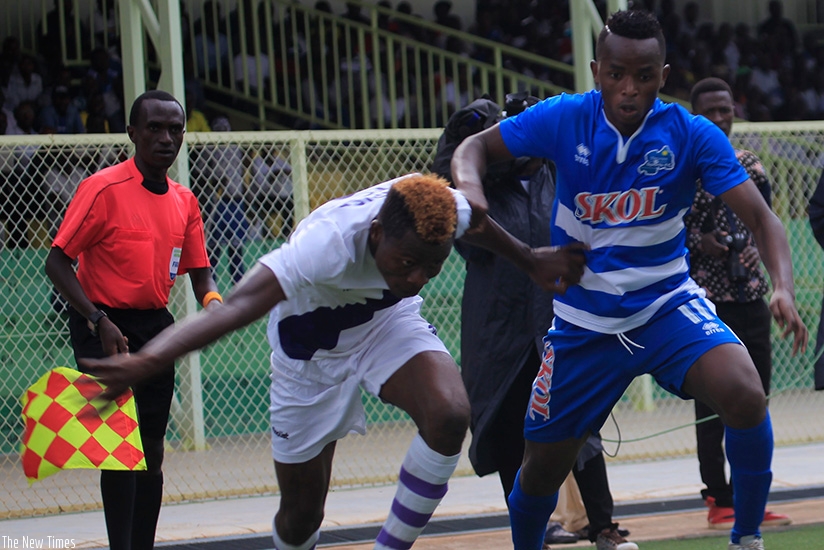 Rayon Sports forward Kevin Muhire (right) battles for possession with a Sunrise FC player during a league match last season. Sunrise host Rayon on Monday in Nyagatare. Sam Ngendahimana.