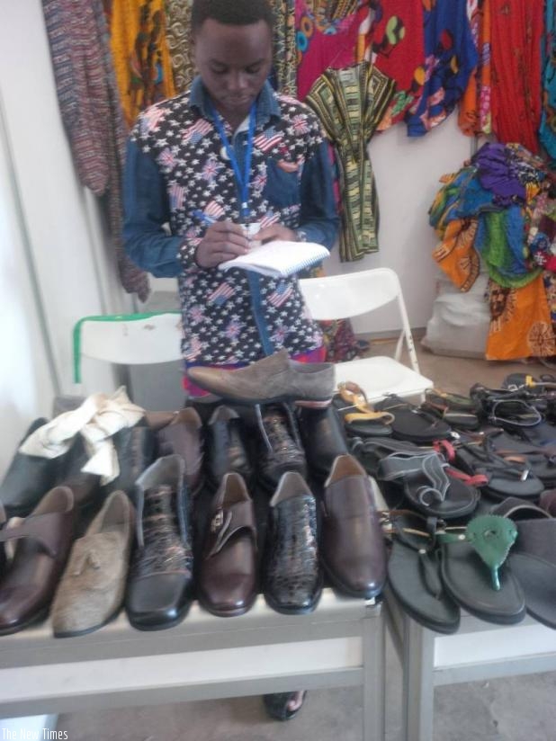 A shoe-maker waits for buyers. Business owners need learn money handling skills. / File.  