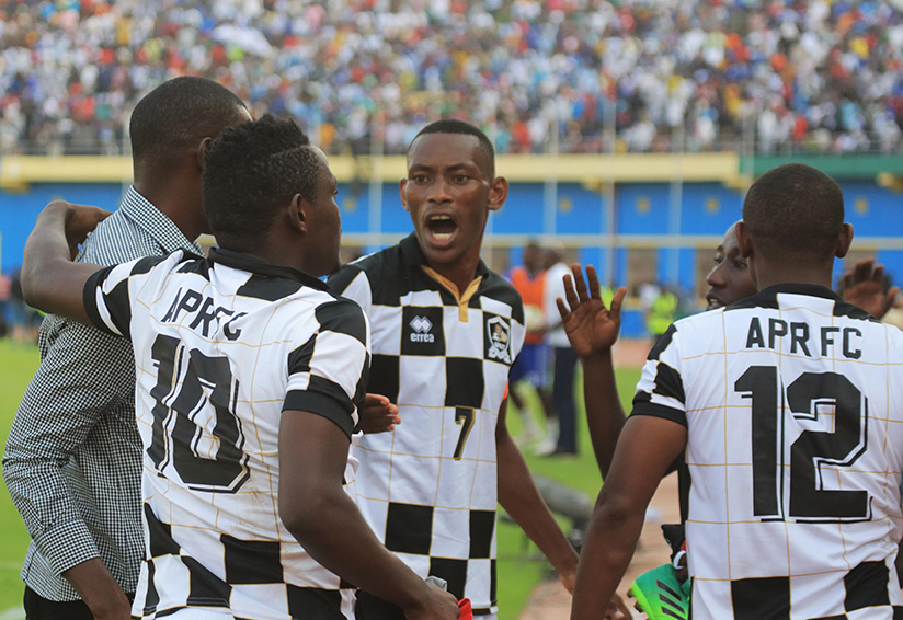 Captain Mugiraneza chats with his coach Mulisa and other players after the match. / Sam Ngendahimana