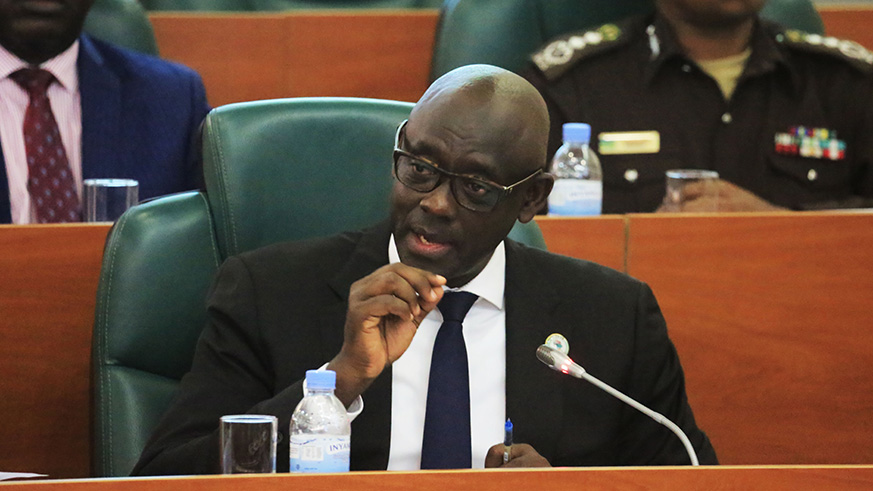 Minister Busingye addresses senators yesterday . (Sam Ngendahimana)