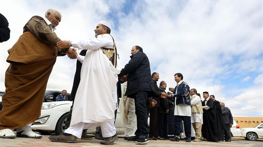 Participants attend the reconciliation meeting in Zintan of Libya on March 28, 2018. The Libyan city of Zintan on Wednesday hosted a reconciliation meeting with representatives of the rival city of Misurata for the first time since armed groups from the two cities fought in 2014 in Tripoli. (Xinhua/Hamza Turkia)