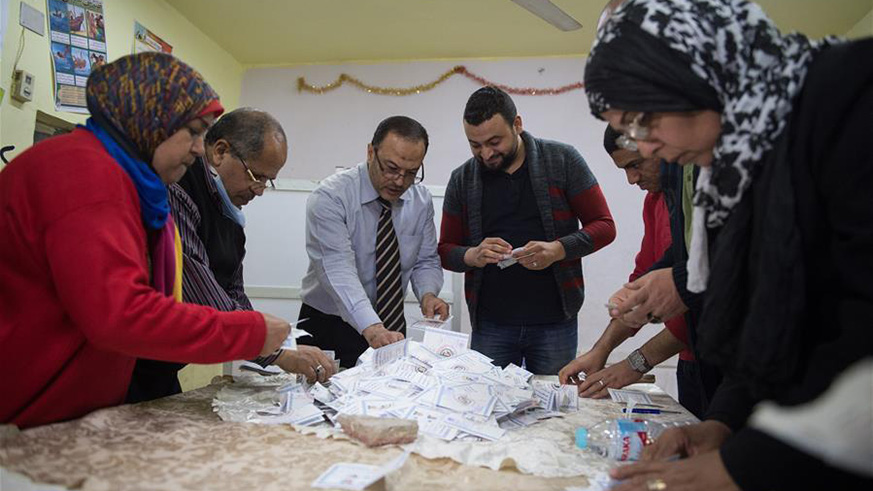 Staff members count ballots at a polling station in Cairo, Egypt, on March 28, 2018. Egypt's 2018 presidential election came to an end on Wednesday, as the polling stations closed nationwide at 10 p.m. local time. (Xinhua/Meng Tao)