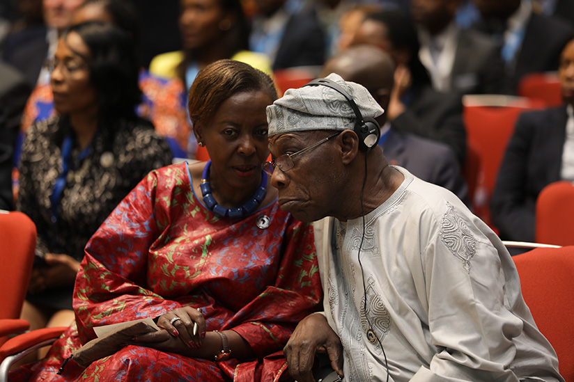 Foreign affairs minister Louise Mushikiwabo chats with Olusegun Obasanjo, former President of Nigeria. (File)