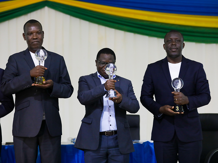 Minister of State for Local government in charge of Socio-Economic Development Cyriaque Harelimana awards FranÃ§ois Habitegeko mayor of Nyaruguru. Timothy Kisambira 