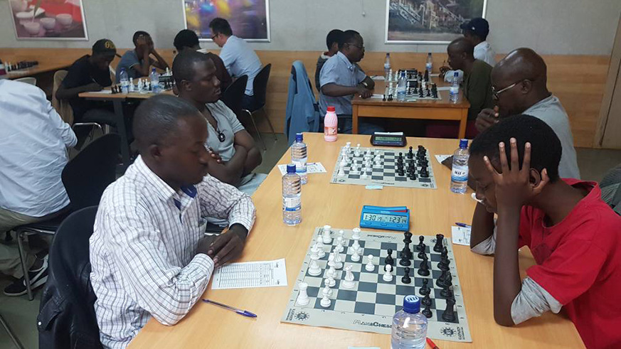 Joseph Nzabanita takes on 15 year-old Murara Urwintwari during a round 2 encounter on Friday afternoon.