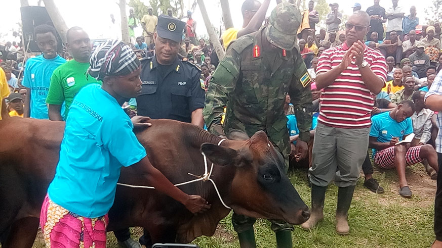 Genocide survivor provided a cow by AERG.Michel Nkurunziza