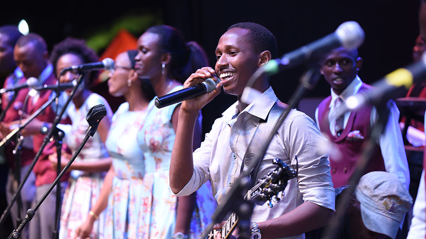 Singer Israel Mbonyi (with a microphone) came to support his fellow gospel artiste Bizimana, and he didnâ€™t disappoint.