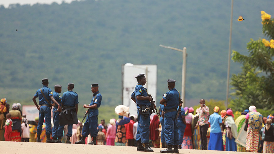 Burundi National Police at the border try to give instructins to the refugees