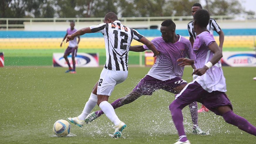 Army side midfielder Iranzi dribbles past La Jeunesse players during the match