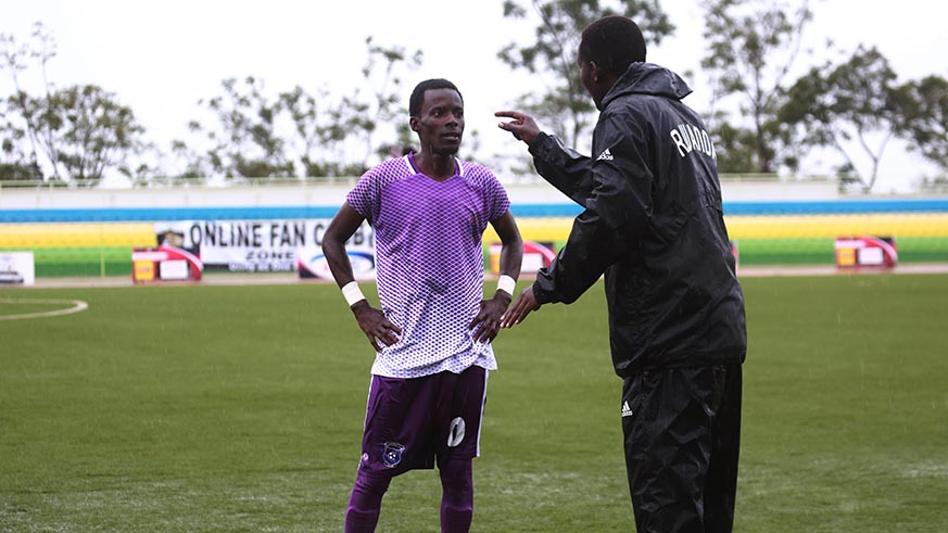 La Jeunesse head coach Fleury Rudasingwa gives instructions to his player during the clash