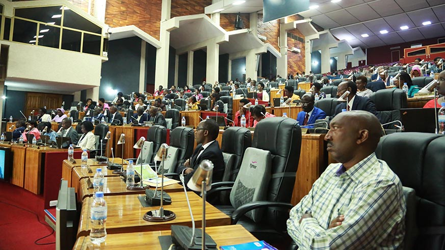Members of the parliament follow the presentation of the Prime Minister