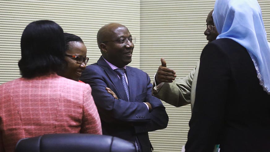 Prime Minister Edouard Ngirente and Minister for Agriculture and Animal Resources Dr Geraldine Mukeshimana follow the President of Senate Bernard Makuza as they chat after the session