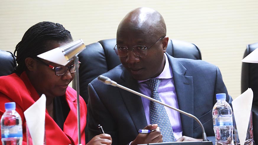 PM Ngirente consults  with the Minister for Agriculture and Animal Resources, Dr Geraldine Mukeshimana, at Parliament yesterday. Sam Ngendahimana. 