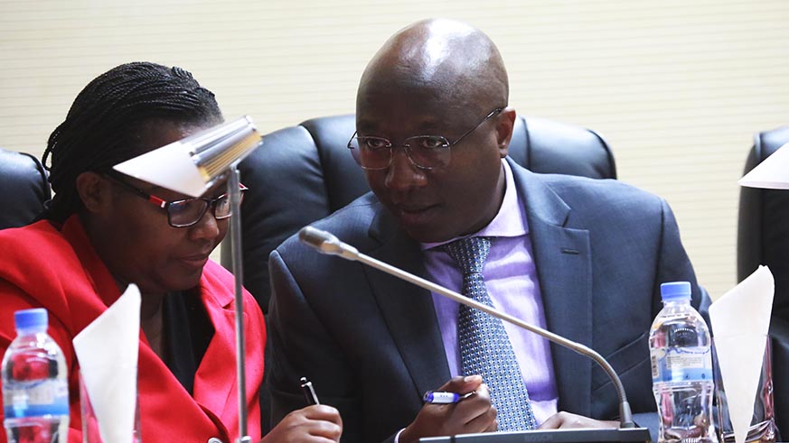 Prime Minister Edouard Ngirente consults with Minister for Agriculture and Animal Resources Dr Geraldine Mukeshimana at the parliament yesterday (Sam Ngendahimana)