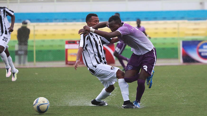 Savio Nshuti tries to protect the ball during the match