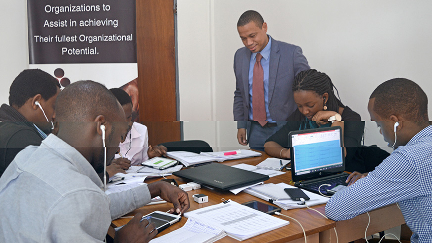 The Managing-Director Jesse Routte with some of the staff members at Three Stones conducting a phone survey of over 1000 small and medium sized businesses in Rwanda on behalf or Harvard University and Rwanda Revenue Authority. (All pics by Joseph Mudingu)