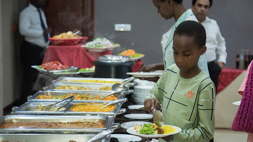 Guests help themselves to the buffet at the event. 