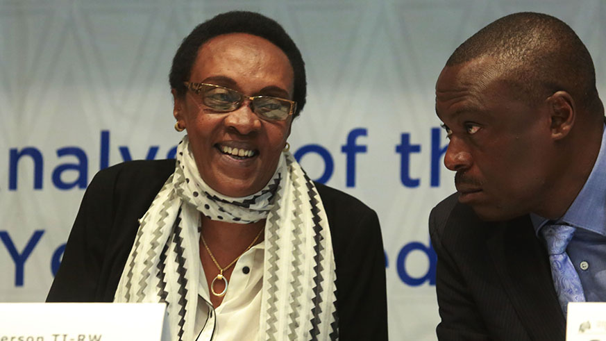 TI chairperson Marie Immaculee Ingabire consults with Clement Musangabatware  Deputy Ombudsman in charge of preventing and fighting corruption