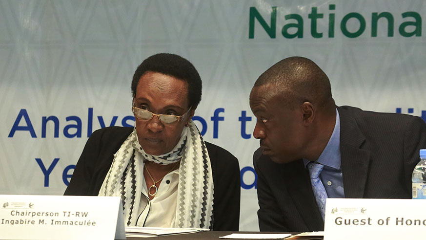 Transparence International Rwanda Marie Immaculee Ingabire chats with Clement Musangabatware  Deputy Ombudsman in charge of preventing and fighting corruption  during the meeting yesterday (Sam Ngendahimana)