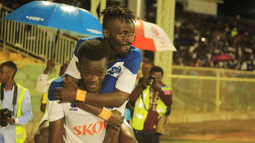 Hussein Shabalala Shabani is carried by teammate Ange Mutsinzi as they celebrate the former's second goal