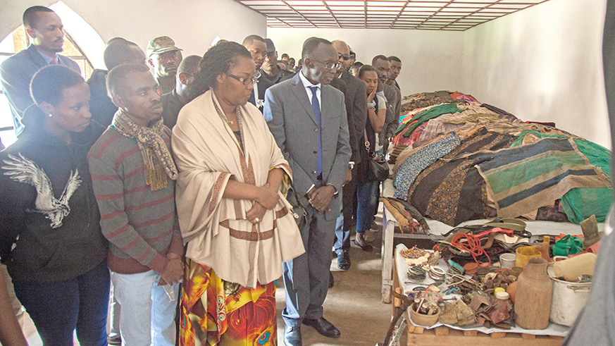 Mourners, led by Chief Justice Sam Rugege (R) and Minister for Agriculture Geraldine Mukeshimana, look at clothing and other artfacts of Genocide victims who were killed inside Nyarubuye Catholic church-turned Genocide memorial in Kirehe District last year. CNLG says there is a shortage of experts in preservation of remains and victimsu2019 belongings.  Nadege Imbabazi