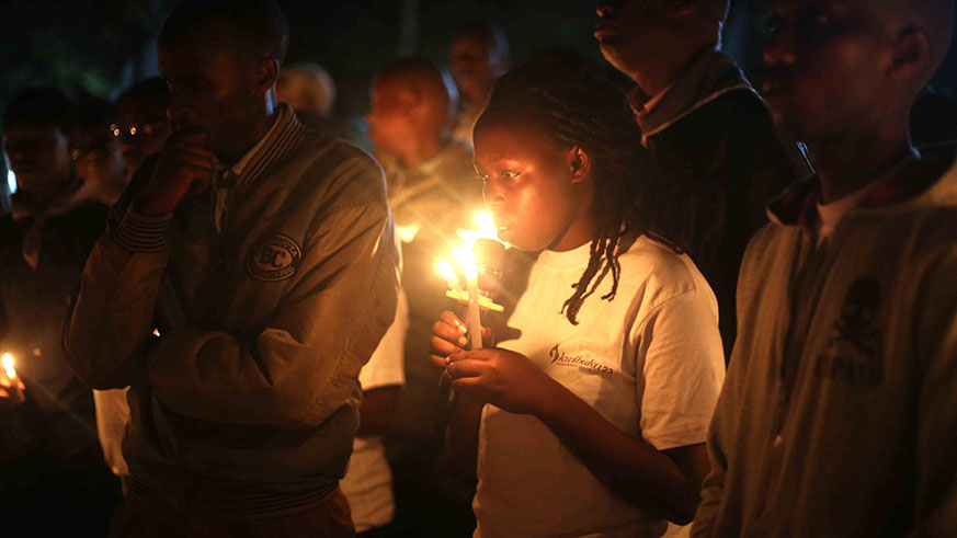 People light candles in remembrance of the victims of the 1994 Genocide against the Tutsi. 