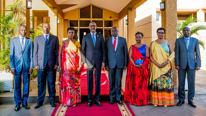 President Kagame poses for a group photo with the State Minister for Economic Planning,u00a0Dr Claudine Uwera (left); the Secretary General, Rwanda Investigation Bureau (RIB), Col Jeannot Ruhunga; and Deputy Secretary General, RIB, Isabelle Kalihangabo (right) shortly after their swearing-in at the Parliamentary Buildings, Kimihurura, yesterday.
