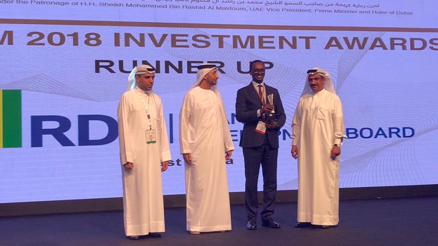  Hategeka receives the Rwanda award during the Annual Investment Meeting in Dubai on Monday. Courtesy.