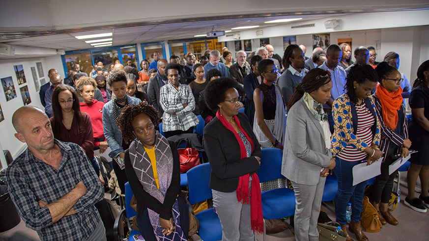 Rwandan ambassador to France, Jacques Kabale, receives a burning candle during the  24th commemoration of the 1994 Genocide against the Tutsi. (Courtesy photos)