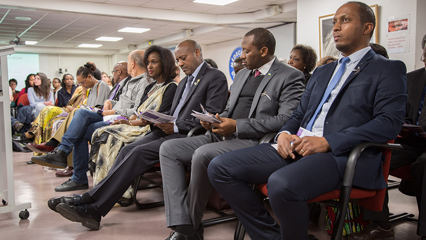 Rwandan ambassador to France, Jacques Kabale, receives a burning candle during the  24th commemoration of the 1994 Genocide against the Tutsi. (Courtesy photos)