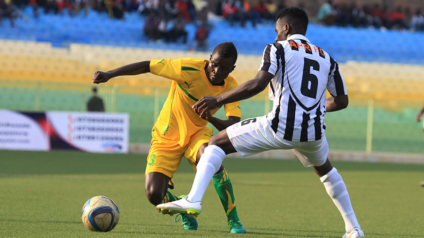 AS Kigali striker Jean-Claude Ndarusanze dribbles past APR defender Martin Twizerimana at Kigali Stadium during a past league match. Sam Ngendahimana
