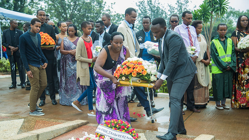 Families and friends lay wreaths on the tombs of Genocide victims at Rebero yesterday. Nadege Imbabazi.