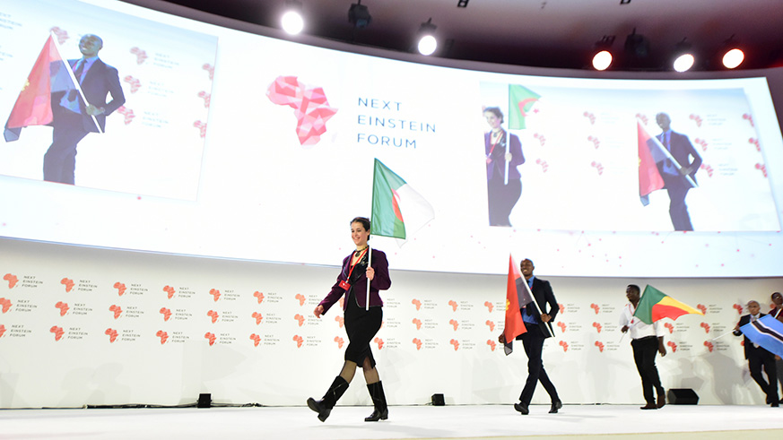 Participants at the recent Next Einstein Forum that was held in Kigali display flags to show that the forum had drawn to a close. A new scientific journal has been created to give scientists a forum to publish their innovations. Courtesy.