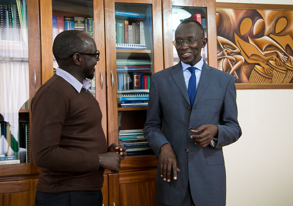 Rugege has a light moment with Athan Tashobya after their interview. (File)