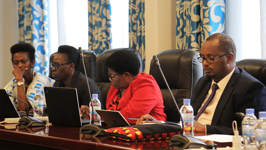 Members of the parliamentary Public Accounts Committee (PAC) follow Minister Judith Uwizeye during the presentation yesterday